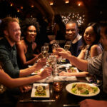 Group of people sitting inside a cafe with having party